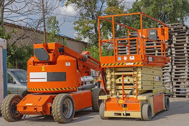 warehouse worker operating forklift to stack inventory in Archer